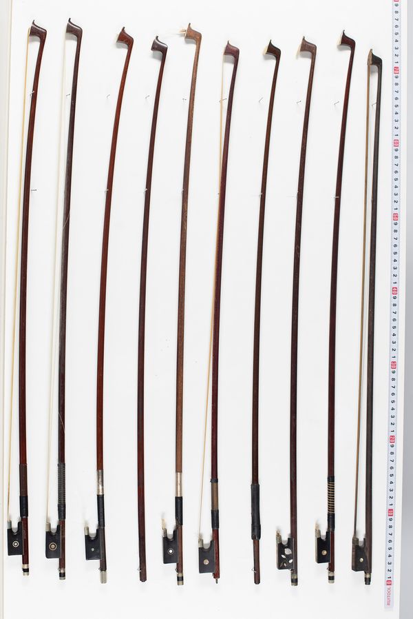 Fourteen violin bows, varying lengths