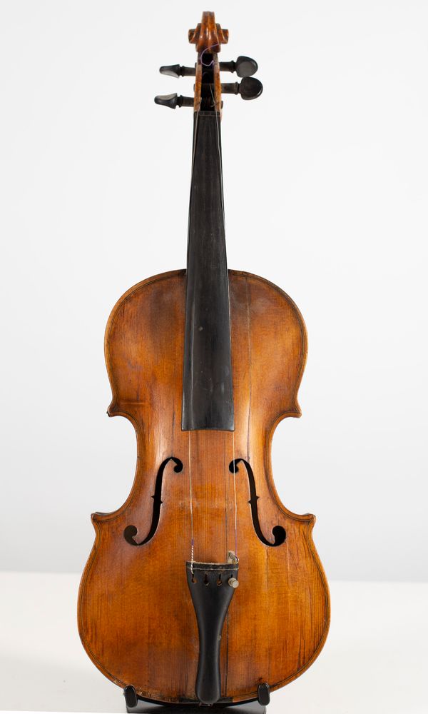 A back and front of a violin and three violins