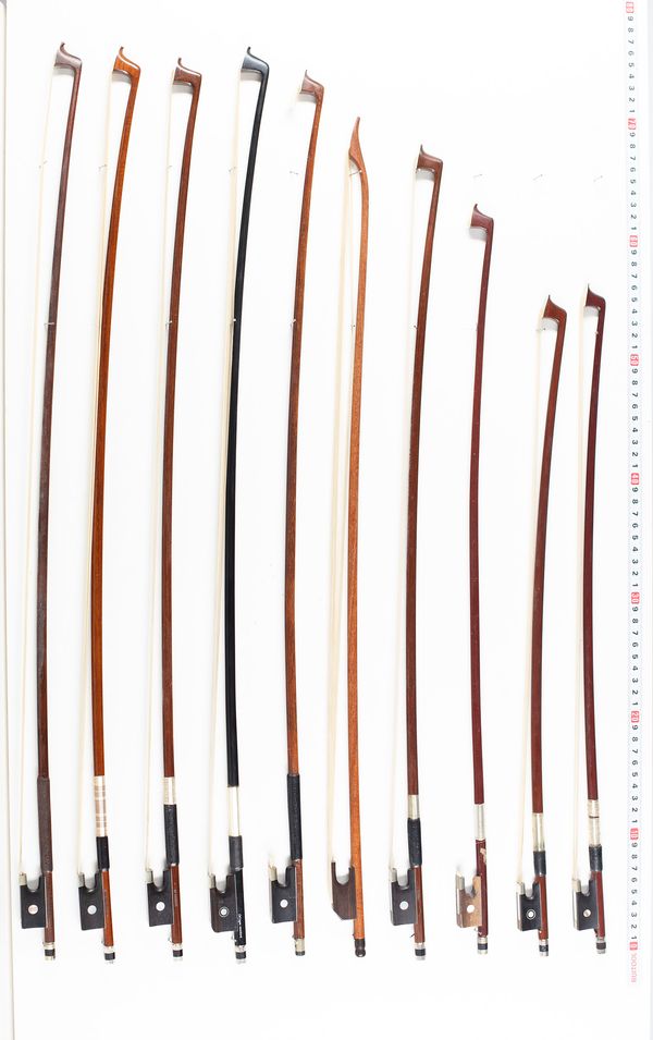 Twenty violin bows and one baroque bow, various lengths