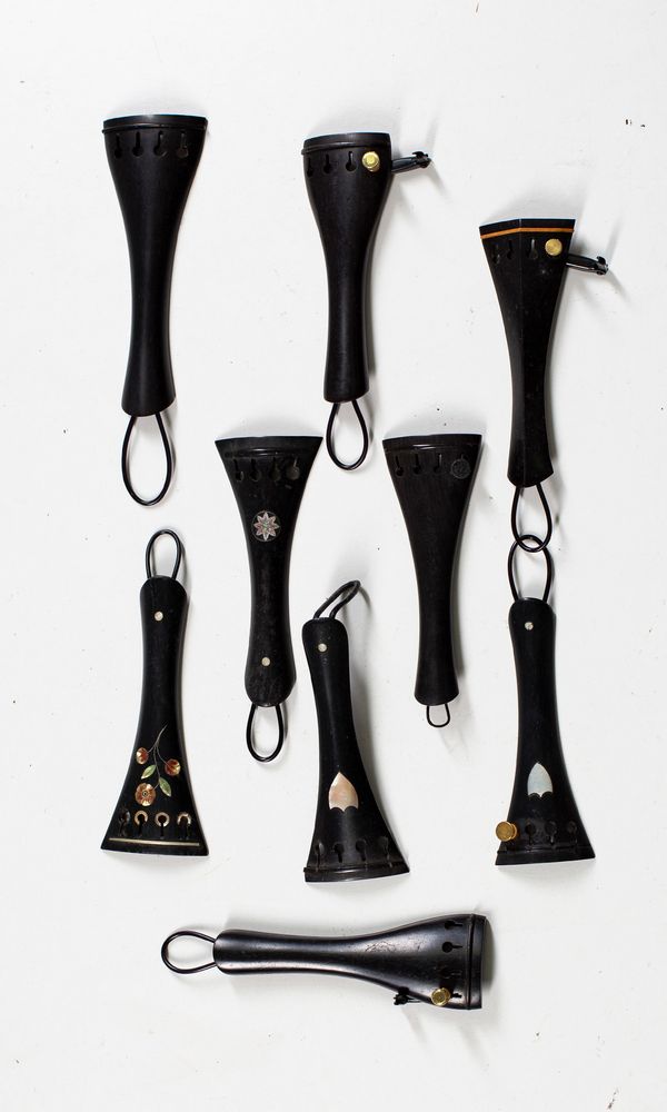 Nine violin tailpieces