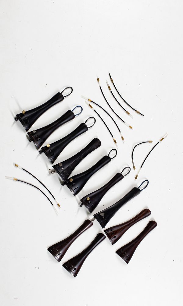 Eleven violin tailpieces, branded Saitenhalter