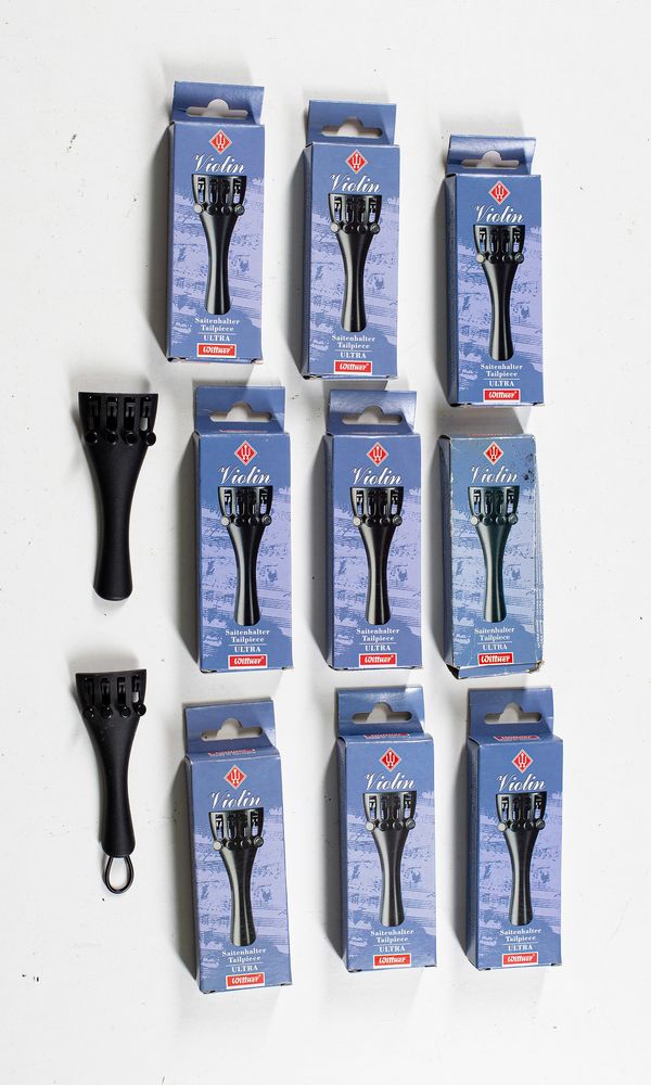 Eleven violin tailpieces branded Saitenhalter