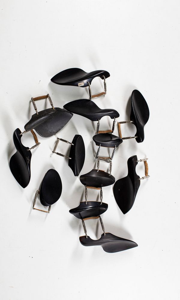 Twelve chin rests, various sizes