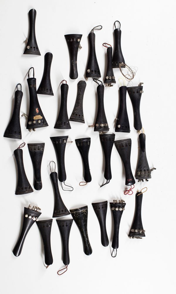 Forty six violin tailpieces, seven cello tailpieces and one double bass tailpiece