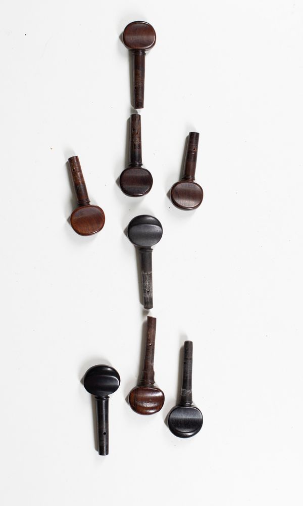 Two sets of cello pegs