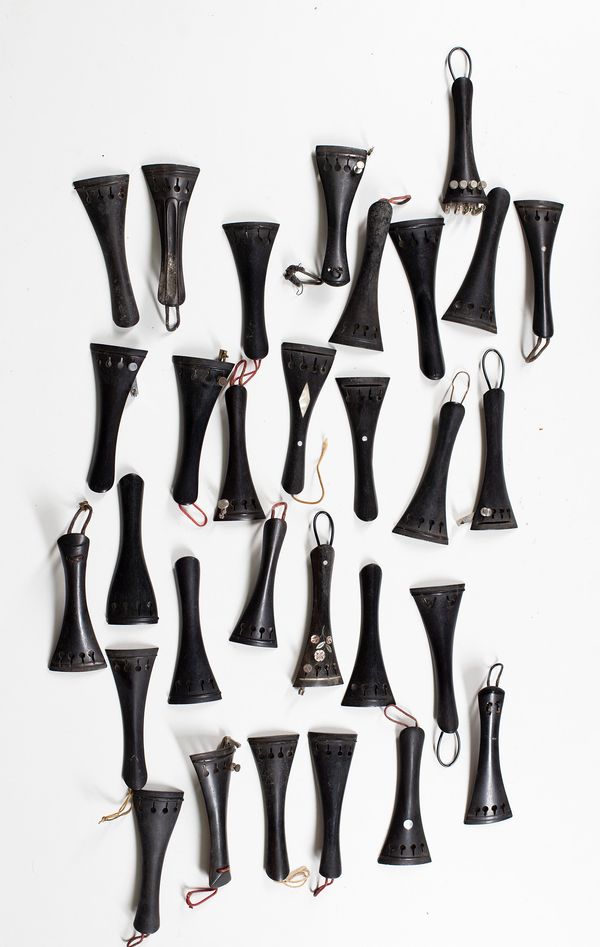 One hundred various violin tailpieces