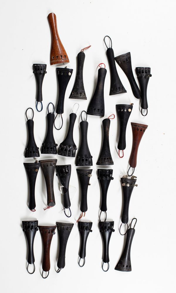 Eighty three violin tailpieces, seven cello tailpieces and one double bass tailpiece