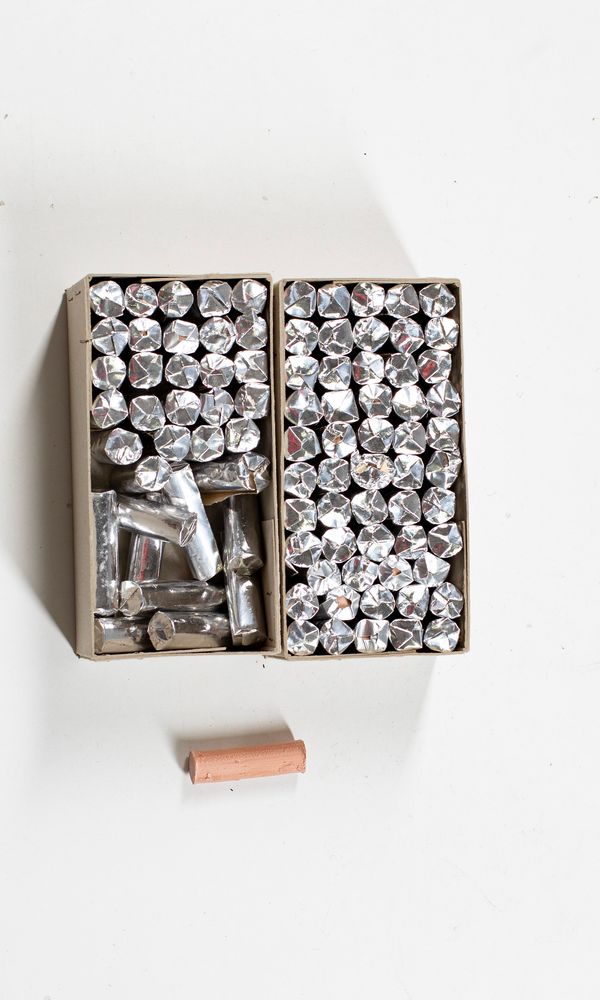 Ninety-one tubes of paste for pegs