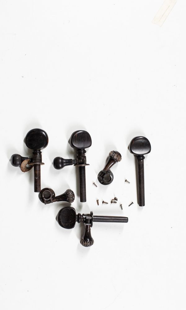 A set of mechanical cello pegs