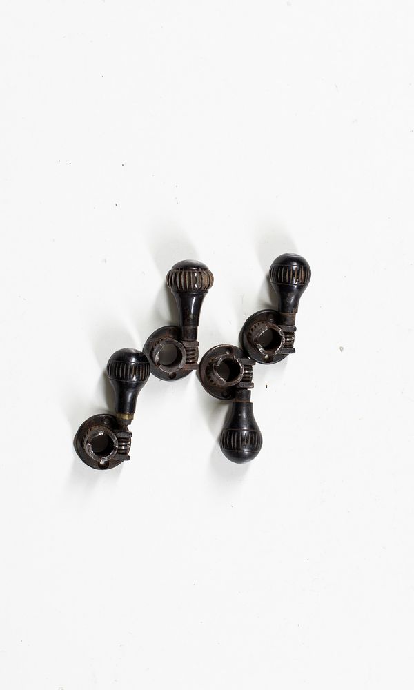 A set of mechanical cello pegs
