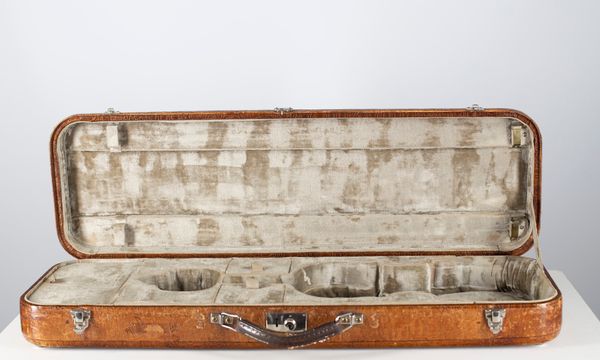 A violin case, branded W. E. Hill & Sons