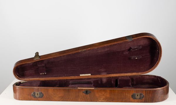 A violin case, branded W. E. Hill & Sons