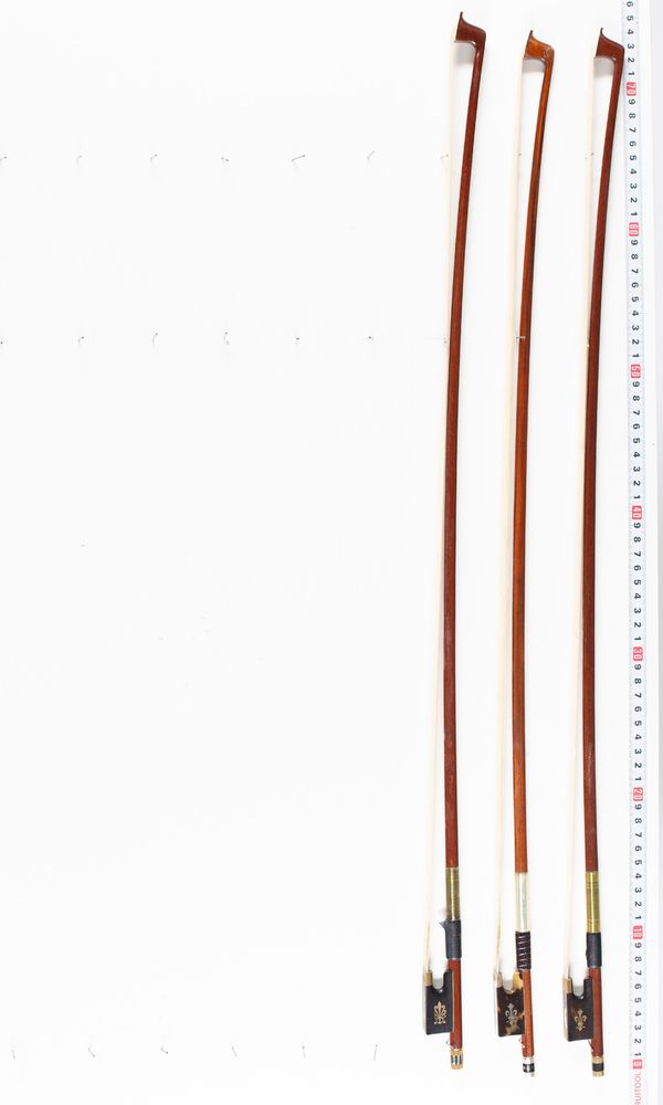 Three violin bows, varying lengths