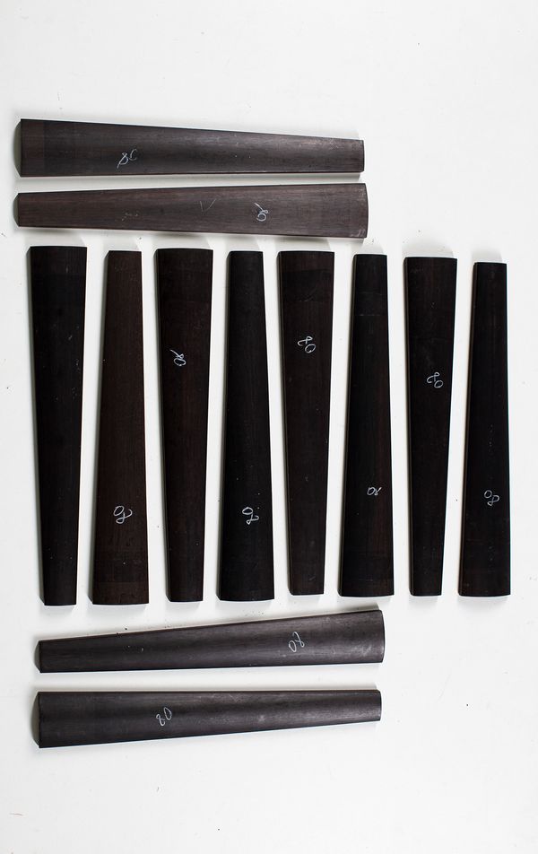 Twelve violin fingerboards