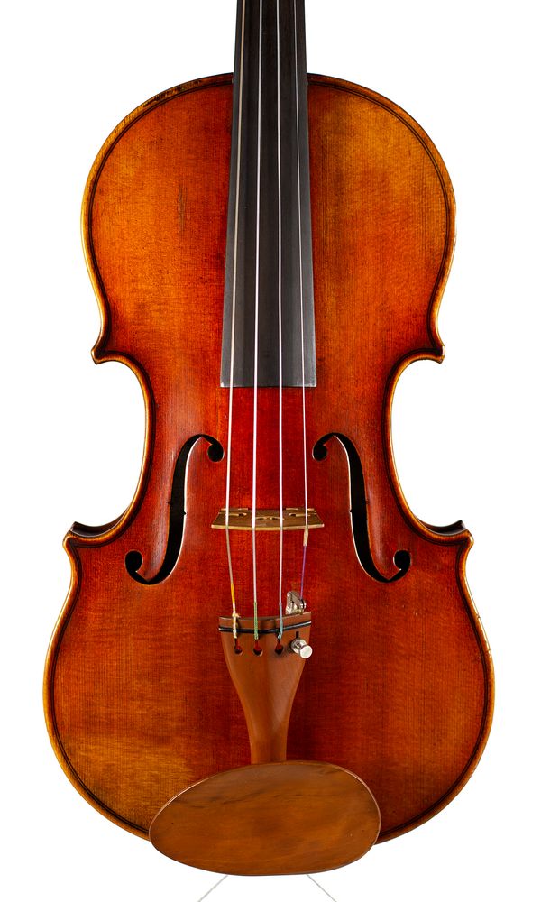 A violin, labelled Petrus Guarnerius