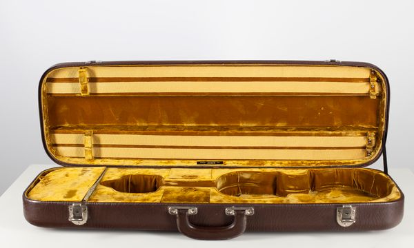 A violin case, branded Jaeger