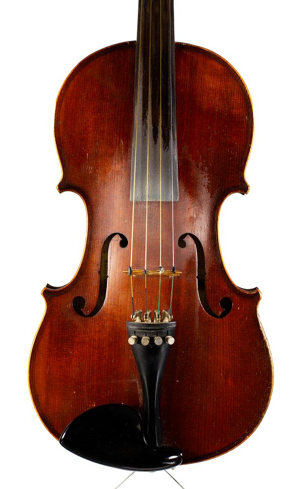 A violin, labelled Medio Fino