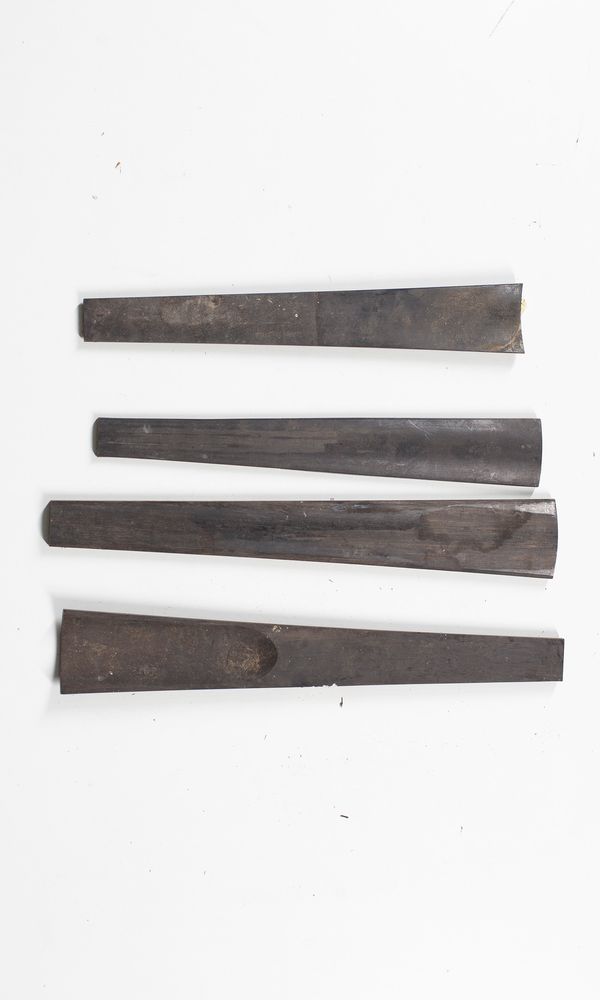 Four partially worked violin fingerboard blanks