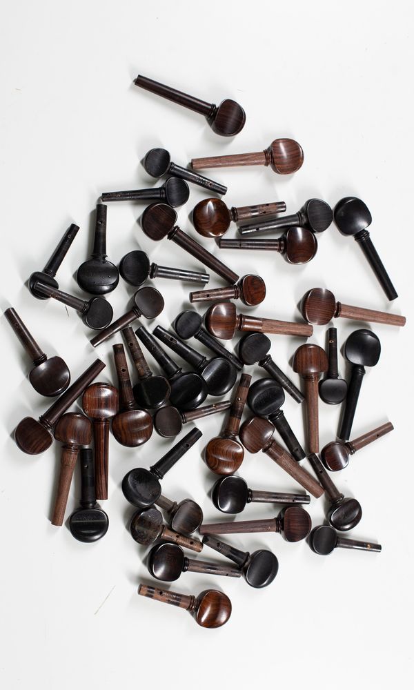 A mixed selection of forty eight cello pegs, varying sizes