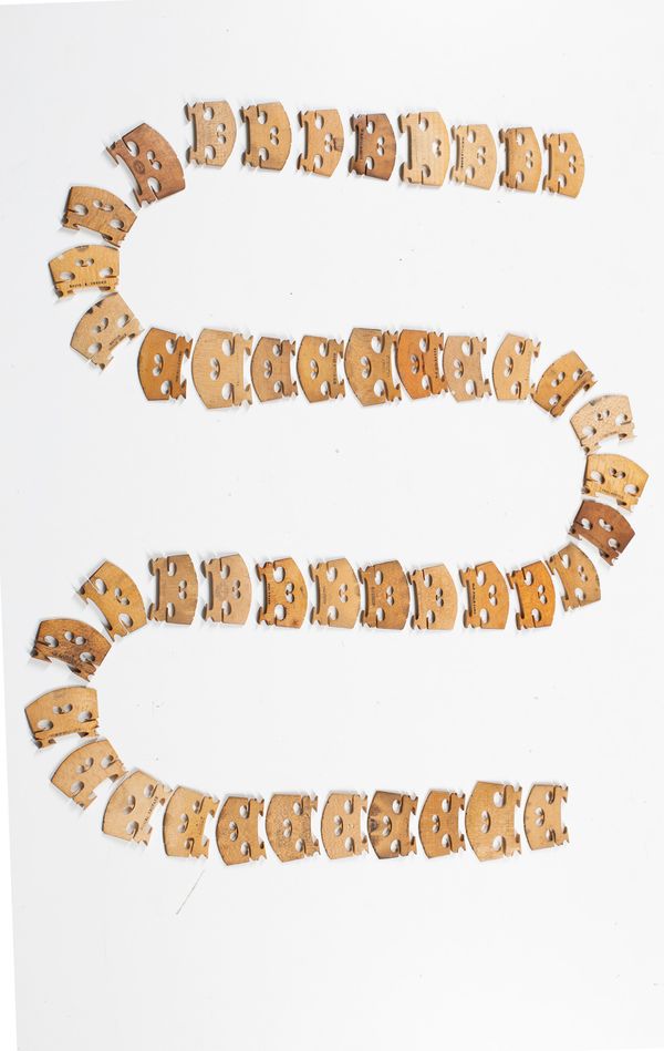 Forty six violin bridges, varying sizes