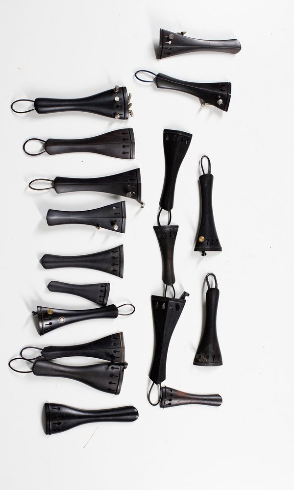 A mixed selection of eighteen tailpieces, varying sizes