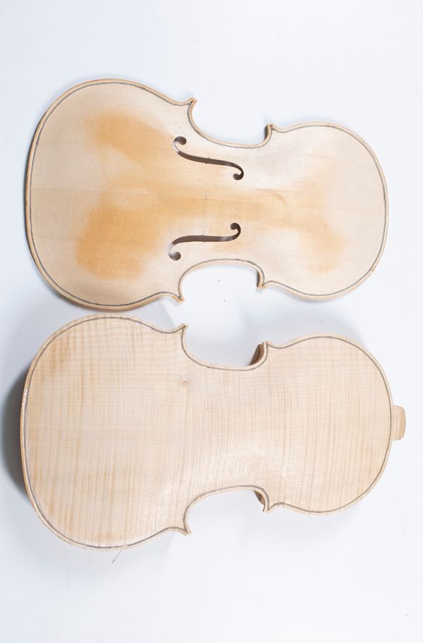 An incomplete viola with additional scroll and two fingerboards