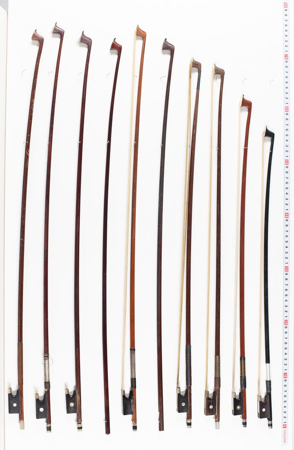 Twelve violin bows and two violin sticks, various length