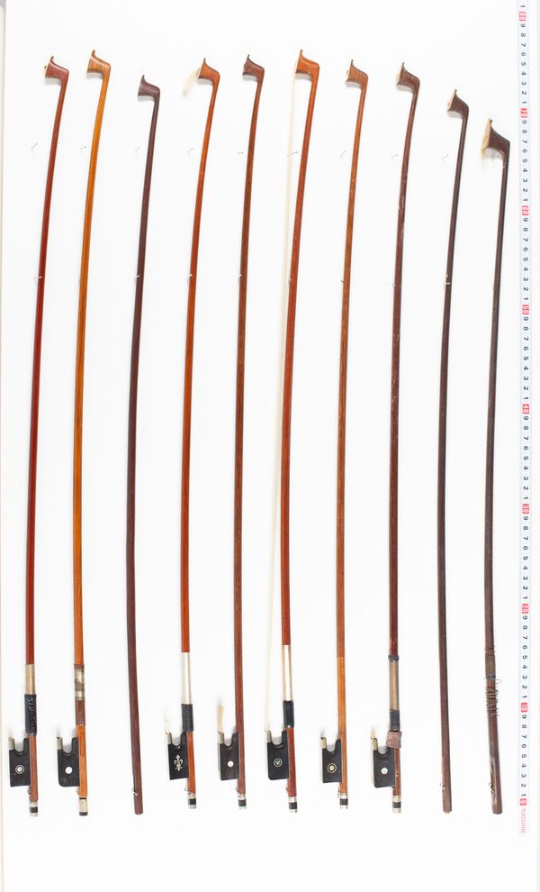 Eighteen violin bows, one cello bow and three sticks, various lengths