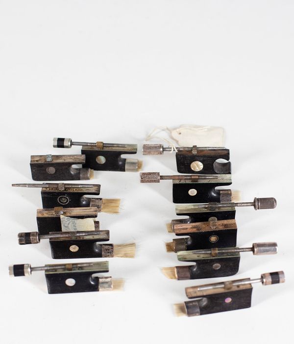 Nine silver-mounted violin frogs and three nickel-mounted violin frogs