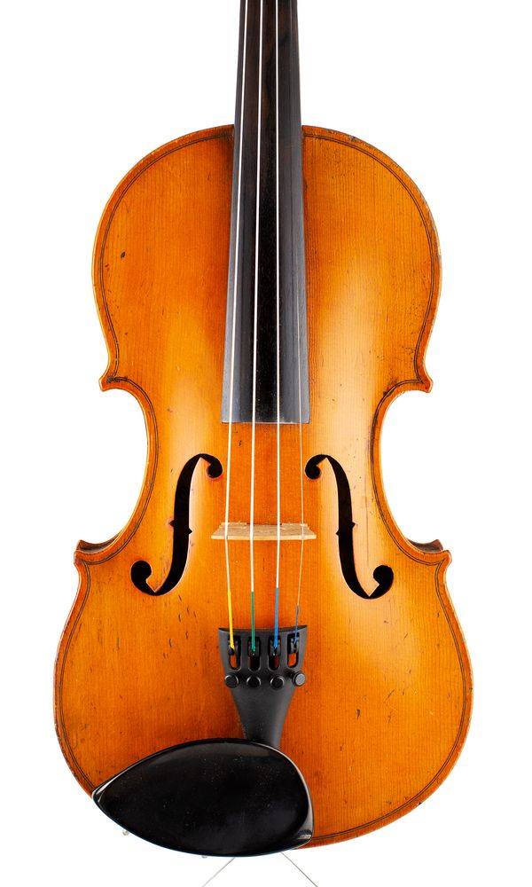 A three-quarter violin, labelled Breton Brevete