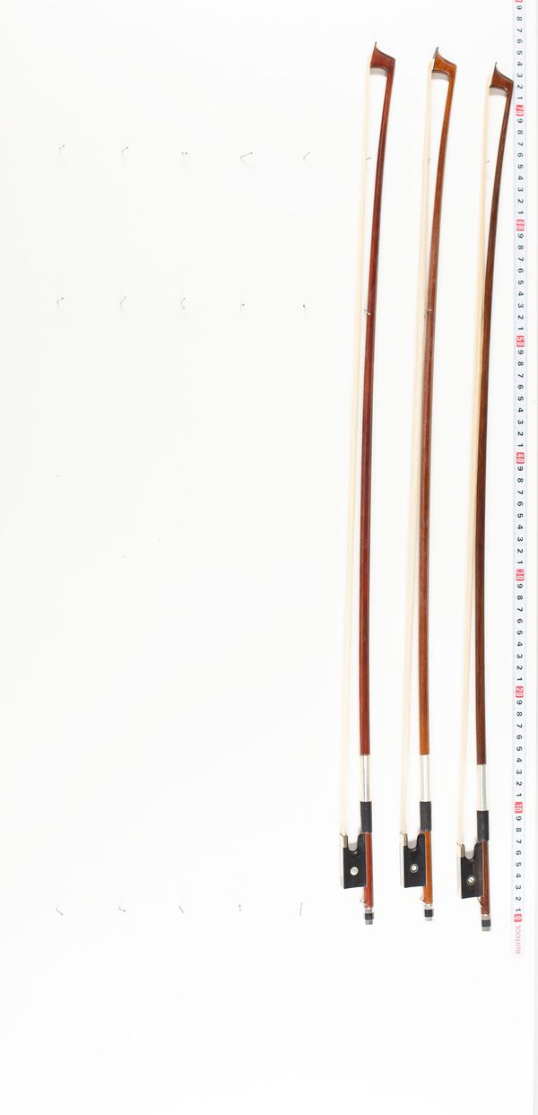 Three violin bows, various lengths