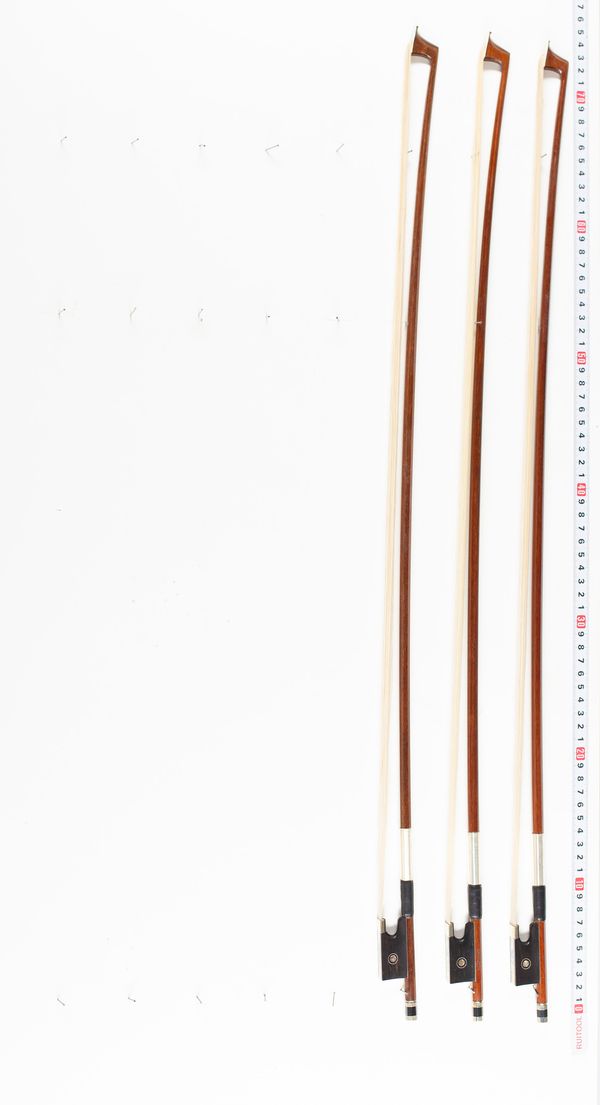 Three violin bows, various lengths