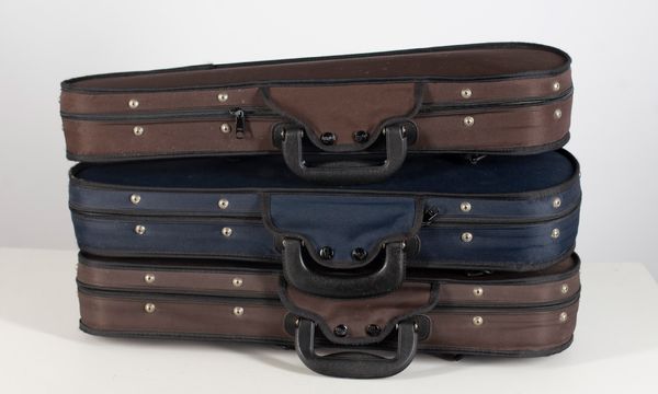 Three one-eighth violin cases