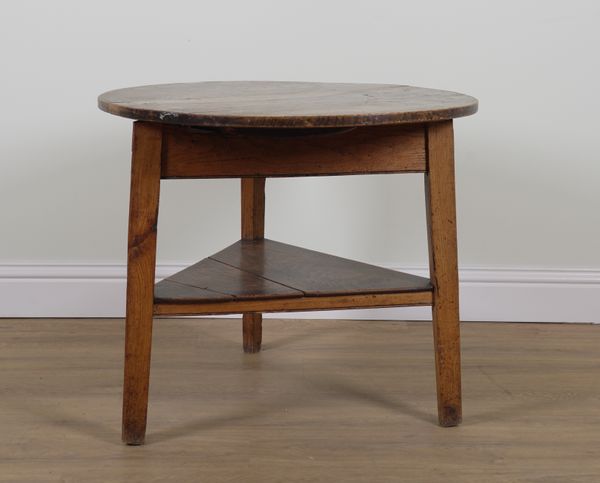 A 19TH CENTURY ELM CIRCULAR CRICKET TABLE