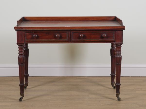 A WILLIAM IV MAHOGANY TWO DRAWER WRITING DESK