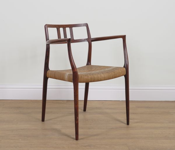 NIEL OTTO MOLLER FOUR J L MOLLER; A MID 20TH CENTURY WOVEN LEATHER SEATED ROSEWOOD OPEN ARMCHAIR