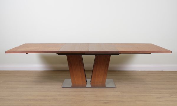 SKOVBY; A WALNUT EXTENDING DINING TABLE