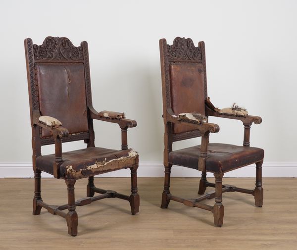 A PAIR OF VICTORIAN CARVED OAK GOTHIC REVIVAL OPEN ARM THRONE CHAIRS (2)