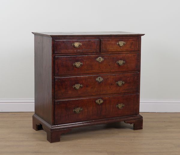 A GEORGE I FIGURED WALNUT FIVE DRAWER CHEST