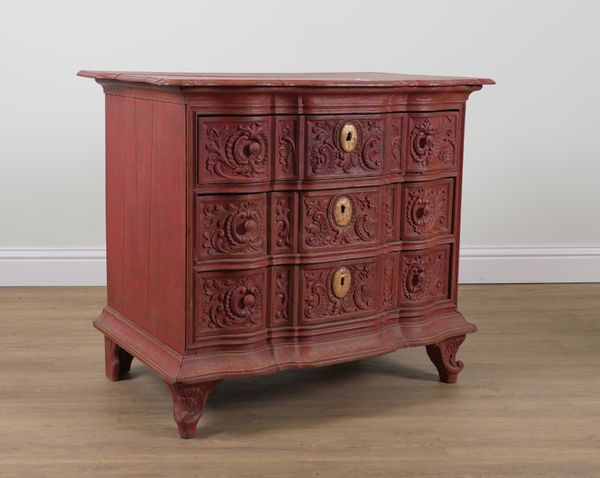 A 19TH CENTURY CONTINENTAL RED PAINTED OAK THREE DRAWER COMMODE