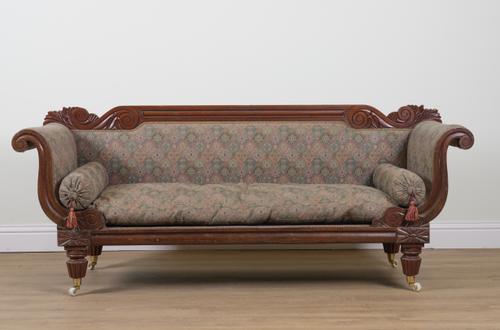A GEORGE IV CARVED MAHOGANY FRAMED SCROLL END SOFA