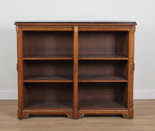 A VICTORIAN GOTHIC REVIVAL PARCEL GILT WALNUT FLOOR STANDING OPEN BOOKCASE