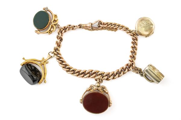 A 9CT GOLD CURB LINK BRACELET, FITTED WITH FIVE PENDANTS AND CHARMS