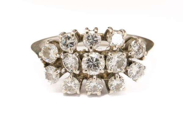 AN 18CT WHITE GOLD AND DIAMOND OVAL CLUSTER RING