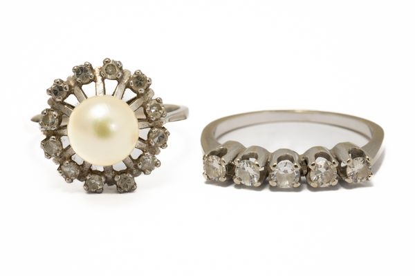 A DIAMOND FIVE STONE RING AND A WHITE GOLD, CULTURED PEARL AND DIAMOND CLUSTER RING (2)