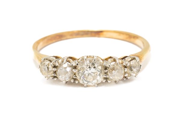 A GOLD AND DIAMOND FIVE STONE RING