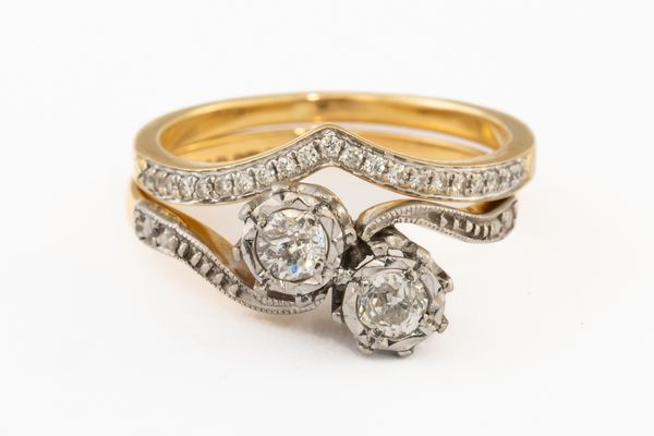 A GOLD AND PLATINUM, DIAMOND TWO STONE CROSSOVER RING AND A GOLD AND DIAMOND V SHAPED WEDDING RING (2)