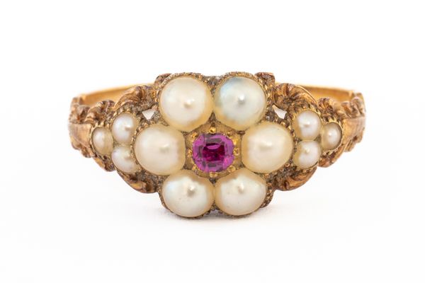 A VICTORIAN GOLD, RUBY AND HALF PEARL CLUSTER RING