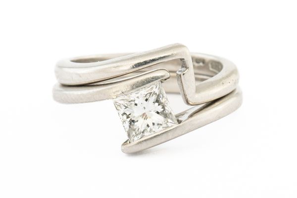 A SINGLE STONE PRINCESS CUT DIAMOND RING AND A MATCHING WEDDING BAND (2)