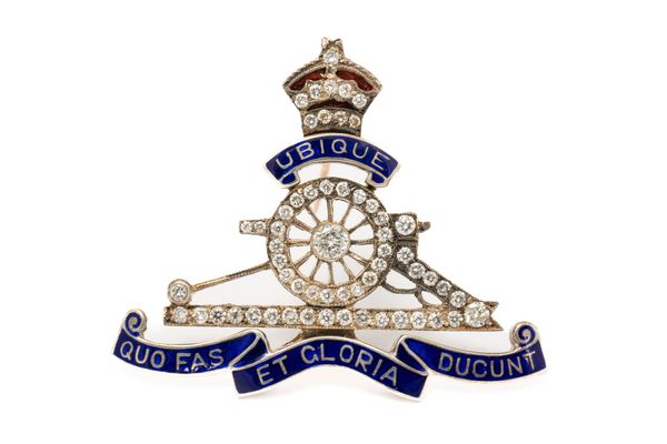 A DIAMOND SET AND ENAMELLED ROYAL ARTILLERY BROOCH